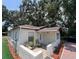 Charming single-story home with a cozy front patio and well-maintained landscaping at 1101 28Th Nw St, Winter Haven, FL 33881