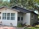 Charming home featuring decorative brick trim, updated windows, and lush landscaping at 1101 28Th Nw St, Winter Haven, FL 33881