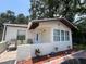 Inviting single-story home featuring a quaint front patio and neatly arranged landscaping at 1101 28Th Nw St, Winter Haven, FL 33881