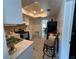 Galley kitchen featuring white countertops and cabinets and stainless steel appliances at 1101 28Th Nw St, Winter Haven, FL 33881