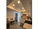 Cozy kitchen with white cabinets, granite countertops, and a unique skylight feature at 1101 28Th Nw St, Winter Haven, FL 33881