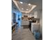 Bright kitchen with white cabinetry, a skylight, and updated appliances at 1101 28Th Nw St, Winter Haven, FL 33881