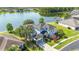 Aerial view of the two-story home with pristine landscaping and lakefront access at 12134 Shadowbrook Ln, Orlando, FL 32828