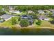An aerial view of a pool home with solar panels near the lake at 12134 Shadowbrook Ln, Orlando, FL 32828