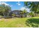 A large screened-in pool area with trampoline and beautiful green lawn at 12134 Shadowbrook Ln, Orlando, FL 32828