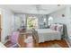 Bedroom with decorative heart mirror and arched windows providing ample natural light at 12134 Shadowbrook Ln, Orlando, FL 32828