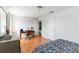 Bright bedroom featuring a wooden desk, chair, and a large dresser at 12134 Shadowbrook Ln, Orlando, FL 32828