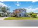 Charming two-story home with a well-manicured lawn, porte-cochere, and classic architectural details at 12134 Shadowbrook Ln, Orlando, FL 32828