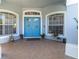 Inviting home entrance featuring a double door entry with decorative wreaths and matching sidelight windows at 12134 Shadowbrook Ln, Orlando, FL 32828
