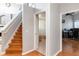 Hallway next to a staircase with a bathroom and office at 12134 Shadowbrook Ln, Orlando, FL 32828