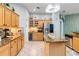 Spacious kitchen with light wood cabinets, granite countertops, and stainless-steel appliances at 12134 Shadowbrook Ln, Orlando, FL 32828