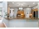 Large, updated kitchen featuring granite counters, ample cabinet space, and modern lighting at 12134 Shadowbrook Ln, Orlando, FL 32828