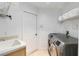 Functional laundry room featuring a sink, modern washer and dryer, and ample storage space at 12134 Shadowbrook Ln, Orlando, FL 32828