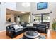 Bright open-concept living room with high ceilings and large windows overlooking the lake at 12134 Shadowbrook Ln, Orlando, FL 32828