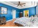 Comfortable main bedroom with bright walls, a bed, and a dresser, providing a serene atmosphere at 12134 Shadowbrook Ln, Orlando, FL 32828