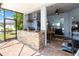 Outdoor kitchen with granite counters, bar seating and stainless grill at 12134 Shadowbrook Ln, Orlando, FL 32828