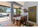 Covered outdoor kitchen area with lake views, grill and a dining set at 12134 Shadowbrook Ln, Orlando, FL 32828