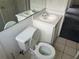 A standard bathroom with a white toilet and vanity at 123 S Roma Way, Kissimmee, FL 34746