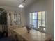 Well-lit dining room featuring a classic china cabinet, large window, and space for Gathering gatherings at 123 S Roma Way, Kissimmee, FL 34746