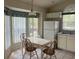 Breakfast nook in kitchen with bright natural light and dining table at 123 S Roma Way, Kissimmee, FL 34746