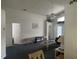 Bright living room with vaulted ceilings, ceiling fan, and neutral paint at 123 S Roma Way, Kissimmee, FL 34746
