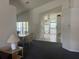 Spacious living room offers an open layout, connecting the dining area to the well-lit kitchen at 123 S Roma Way, Kissimmee, FL 34746