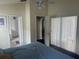 Comfortable bedroom with a ceiling fan and access to the Primary bathroom and additional living spaces at 123 S Roma Way, Kissimmee, FL 34746