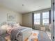 Cozy bedroom featuring modern decor, natural light, wood floors, and a comfortable bed at 1404 Axel Cir, Winter Haven, FL 33880