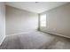 Empty bedroom with carpeting and a window providing natural light at 1404 Axel Cir, Winter Haven, FL 33880