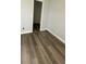 Cozy bedroom showcasing luxury vinyl plank flooring and fresh neutral paint at 1427 Orchid Ln, Kissimmee, FL 34744