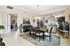 Elegant dining area with stylish furnishings, natural light, and open layout at 1703 Encinitas Way, Kissimmee, FL 34759