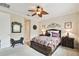 Comfortable main bedroom with ceiling fan and decorative accents at 1703 Encinitas Way, Kissimmee, FL 34759