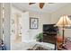 Home office area showcases a television and a cozy spot for work or leisure at 1703 Encinitas Way, Kissimmee, FL 34759
