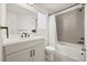 Bright bathroom featuring a white vanity with modern fixtures, a toilet, and shower-tub combo at 1765 Petiole Pl, Kissimmee, FL 34744