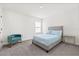 Bedroom with carpet, window, accent chair, and modern furnishings at 1765 Petiole Pl, Kissimmee, FL 34744