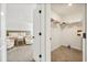 Bright bedroom with carpet, a walk-in closet, and seating area featuring chairs and accent table at 1765 Petiole Pl, Kissimmee, FL 34744