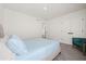 Bedroom with carpet, window, accent chair, and double-door closet at 1765 Petiole Pl, Kissimmee, FL 34744