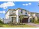 Charming two-story home boasts a brick driveway and lush landscaping at 1765 Petiole Pl, Kissimmee, FL 34744