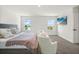 A spacious main bedroom with neutral tones, large windows, flat screen television, and ample natural light at 1765 Petiole Pl, Kissimmee, FL 34744