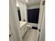 Clean bathroom featuring a vanity with ample storage and a shower-tub combination at 200 Citrine Loop, Kissimmee, FL 34758