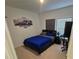 Modern bedroom featuring a bed, a window, and decorated with a car print on the wall at 200 Citrine Loop, Kissimmee, FL 34758