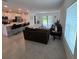 Open floor plan combining the kitchen, dining, and living areas, perfect for entertaining at 200 Citrine Loop, Kissimmee, FL 34758