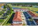 Beautiful aerial view overlooking the community, a large pond, and a manicured golf course at 2000 Greenbriar Ter, Davenport, FL 33837