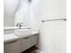 Bathroom with a vessel sink, chrome faucet, white countertop, gray vanity and mirror at 2000 Greenbriar Ter, Davenport, FL 33837