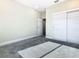 The bedroom features a closet with sliding door and neutral walls and carpet at 2000 Greenbriar Ter, Davenport, FL 33837