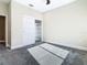 This bedroom has great closet and features neutral walls and carpet at 2000 Greenbriar Ter, Davenport, FL 33837