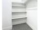 Walk-in closet featuring multiple shelves and a rod for ample storage space at 2000 Greenbriar Ter, Davenport, FL 33837