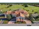 Aerial view of the luxurious clubhouse with golf course views, perfect for social gatherings at 2000 Greenbriar Ter, Davenport, FL 33837