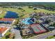 Aerial view featuring playground, tennis courts, and luxurious pool, perfect for resort-style living at 2000 Greenbriar Ter, Davenport, FL 33837