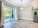 An open dining area leads to a patio with a sliding glass door and a view of the yard at 2000 Greenbriar Ter, Davenport, FL 33837